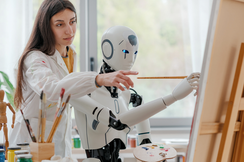 woman-teaching-painting-to-a-robot-2025-01-07-04-43-47-utc